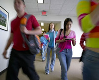 Students walking through a hallway.